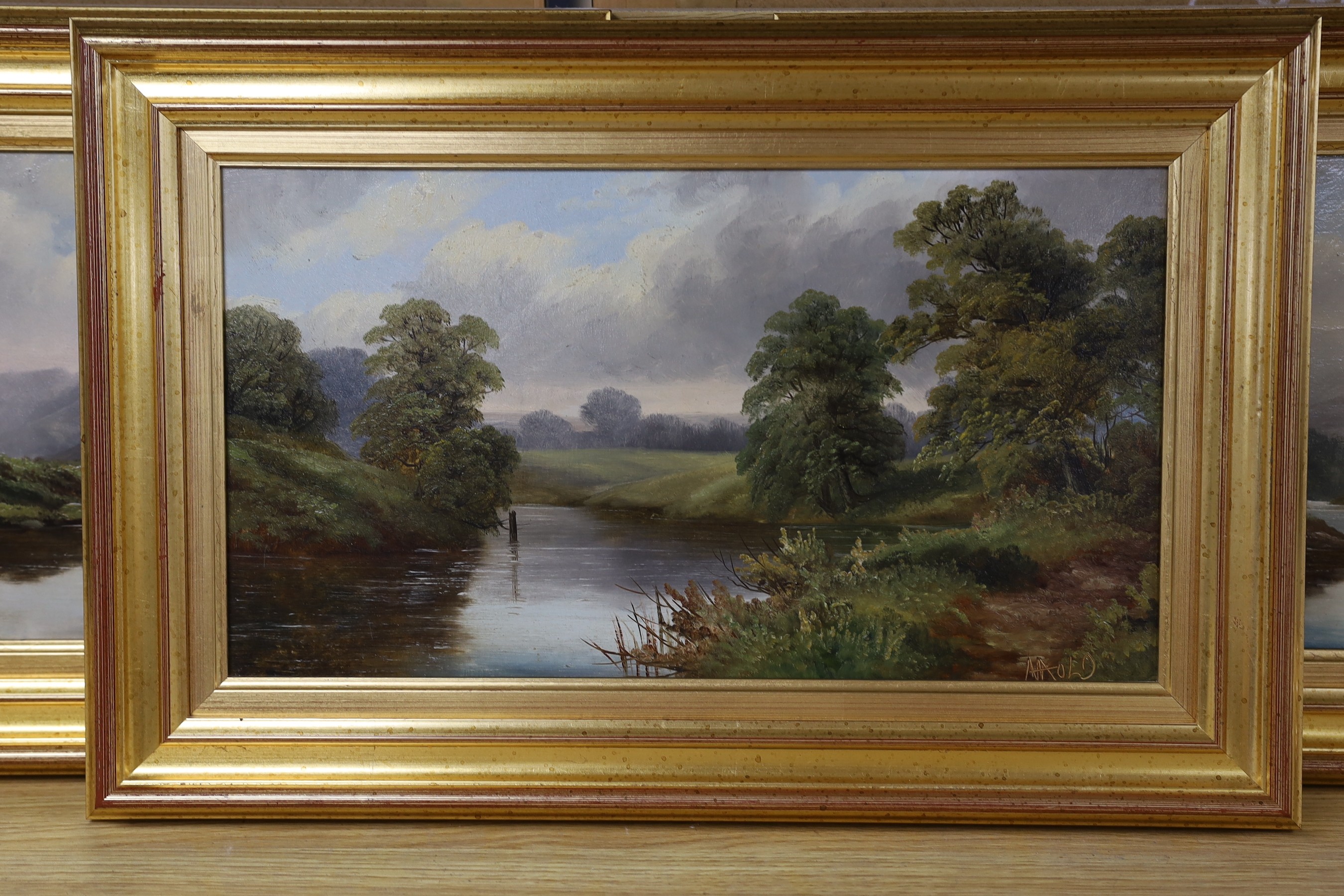 English School, three oils on board, River landscapes, indistinctly signed, 22 x 40cm